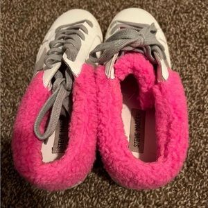 White sneakers with pink fuzzy detail